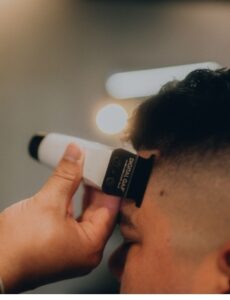 Barber creating a skin fade on a client