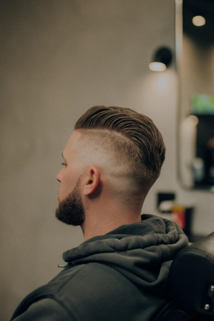 Textured men's haircut styled at a high-quality barbershop